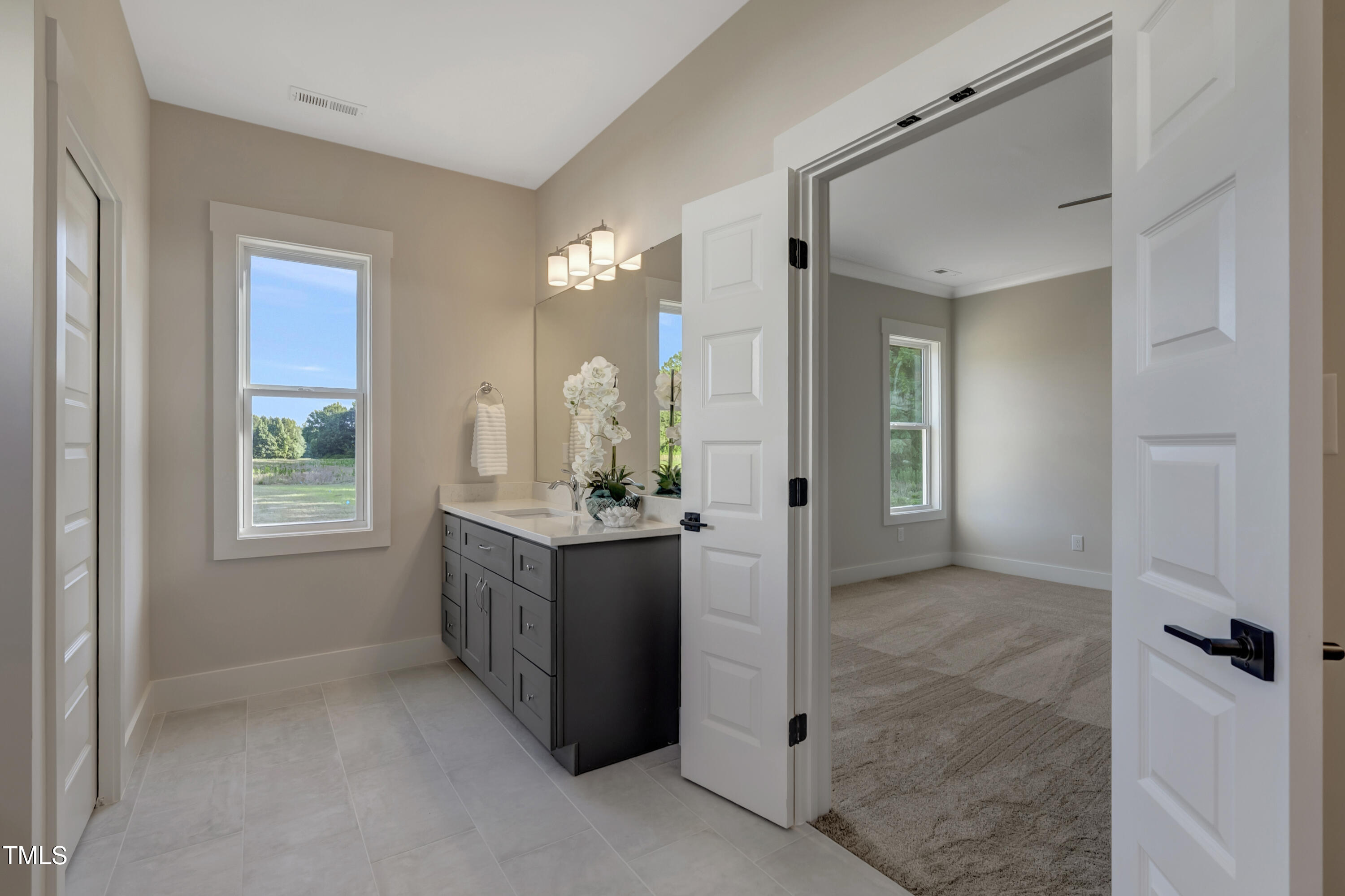 0 Radio Tower Road Wilson, NC 27893 - Photo 17 of 48 a bathroom with a granite countertop sink a mirror and a shower