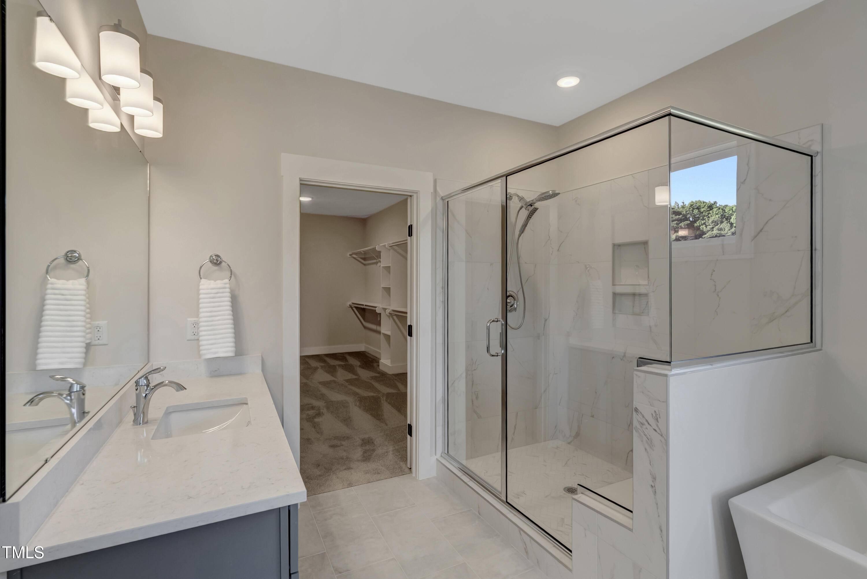 0 Radio Tower Road Wilson, NC 27893 - Photo 18 of 48 a bathroom with a shower sink vanity and mirror