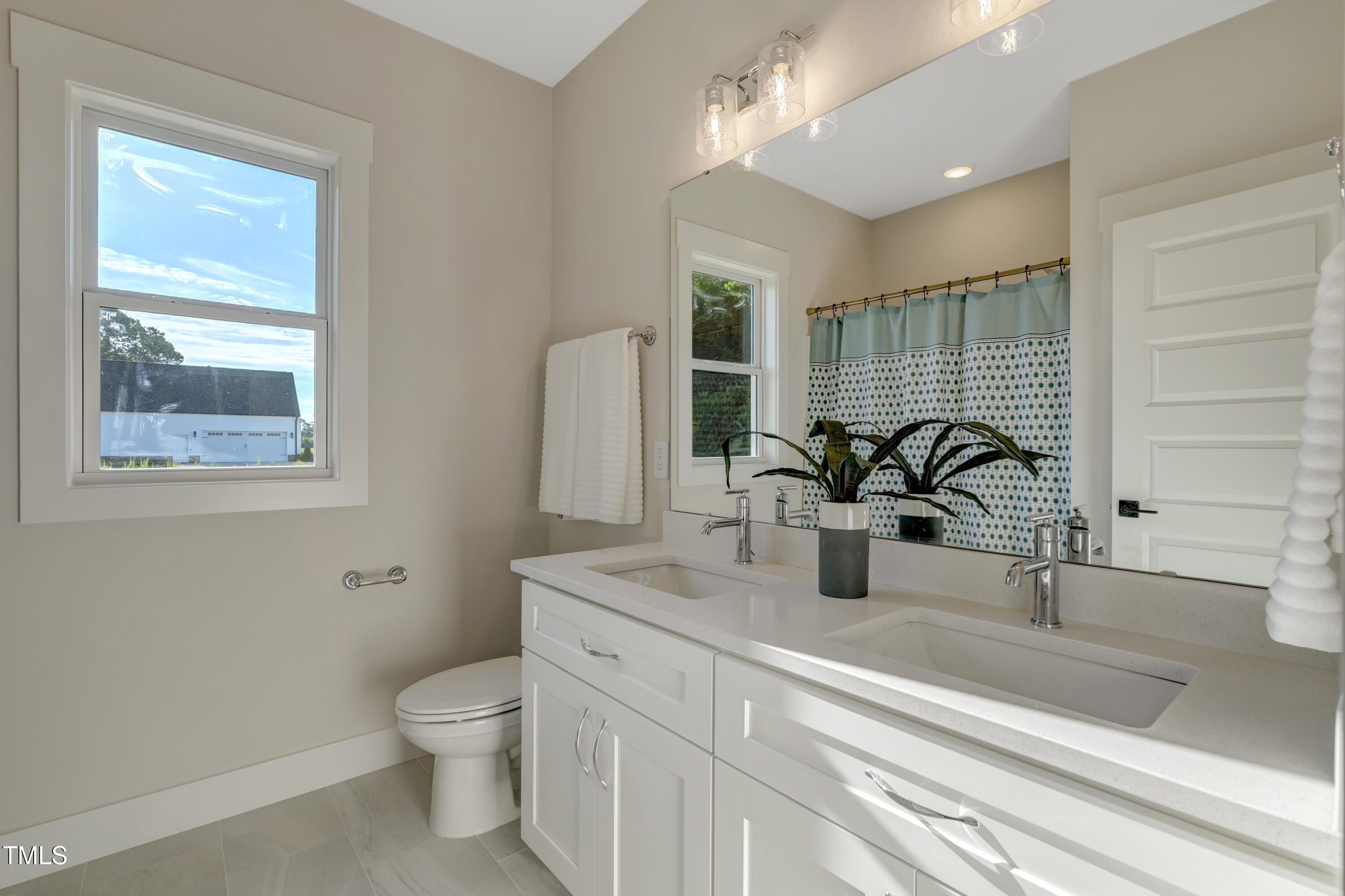 0 Radio Tower Road Wilson, NC 27893 - Photo 22 of 48 a bathroom with a toilet a sink and glass door