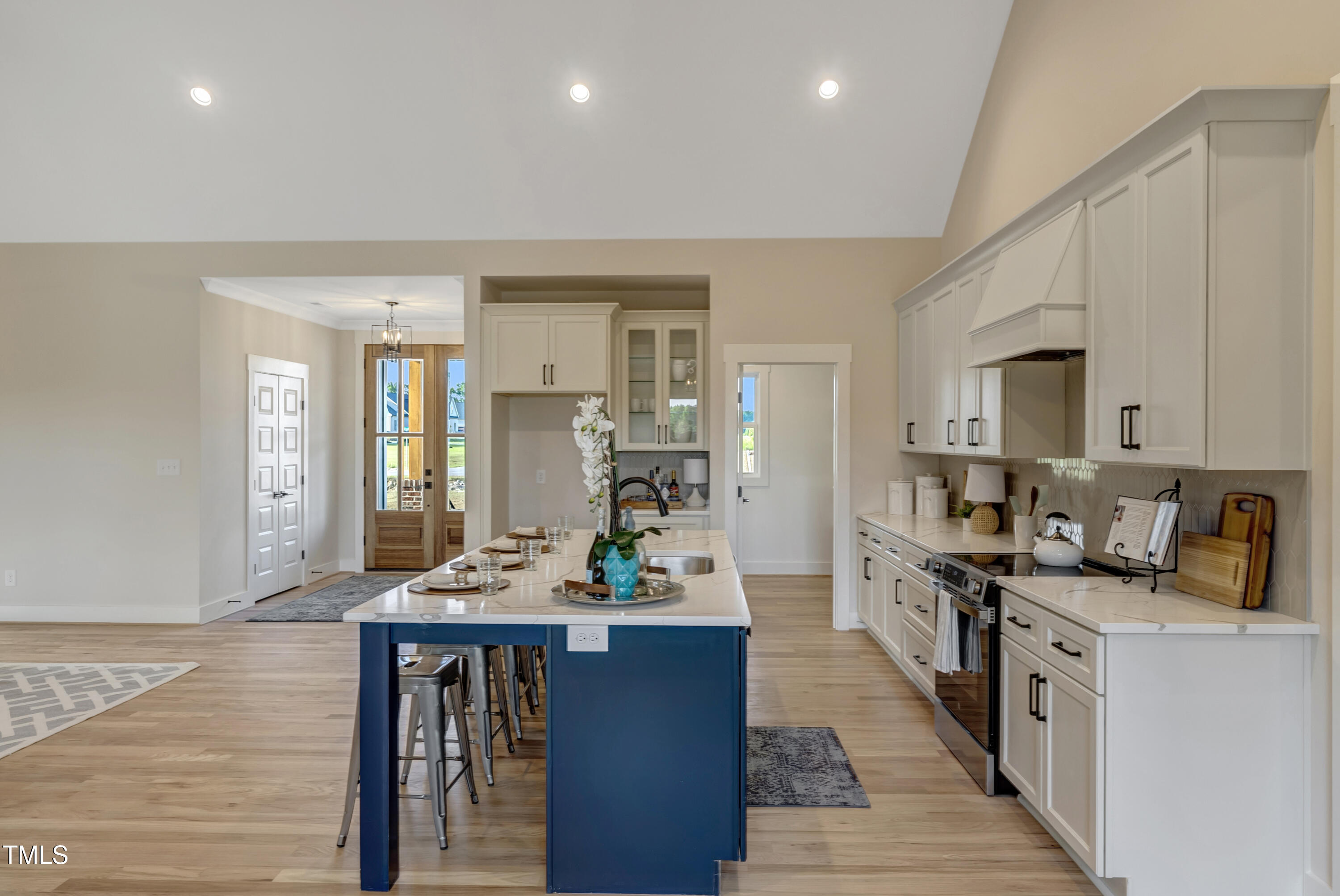 0 Radio Tower Road Wilson, NC 27893 - Photo 6 of 48 a open kitchen with stainless steel appliances granite countertop a stove top oven a sink dishwasher a dining table and chairs with wooden floor