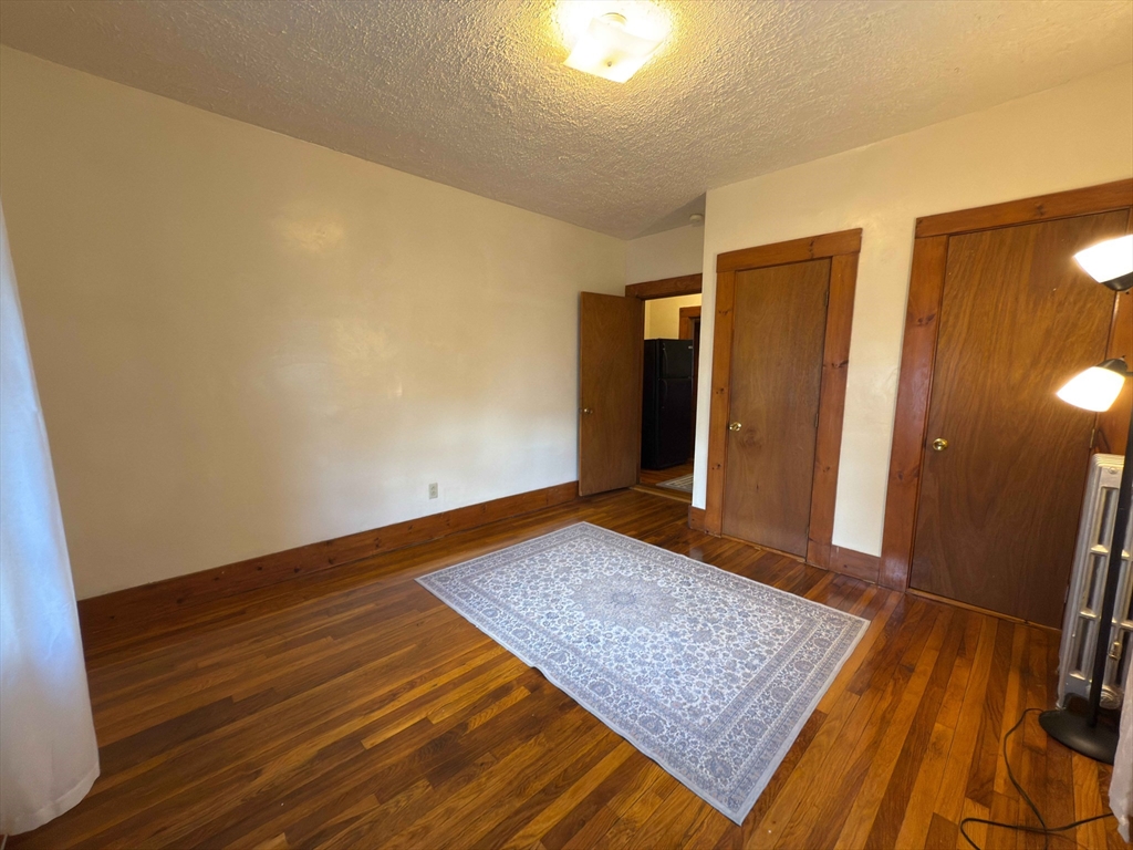 3965 Washington Street Boston, MA 02131 - Photo 9 of 18 a view of hallway with wooden floor