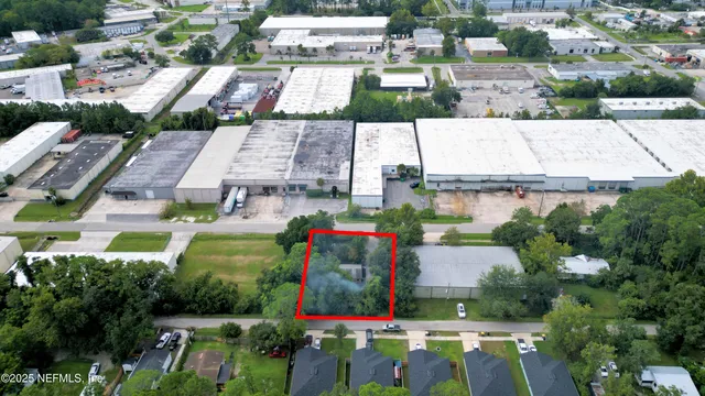 an aerial view of residential houses with outdoor space