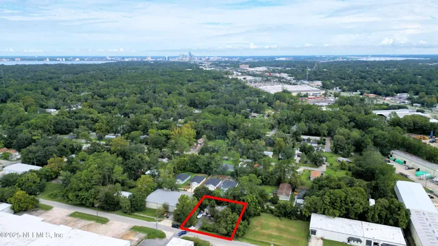 a view of a backyard with a car parked in it