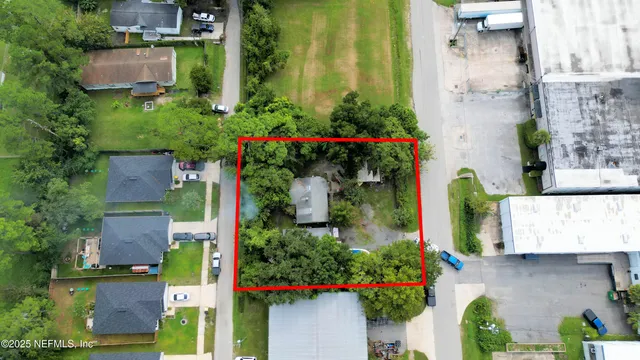 an aerial view of house with yard