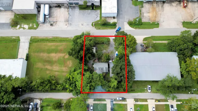 an aerial view of multiple houses with yard
