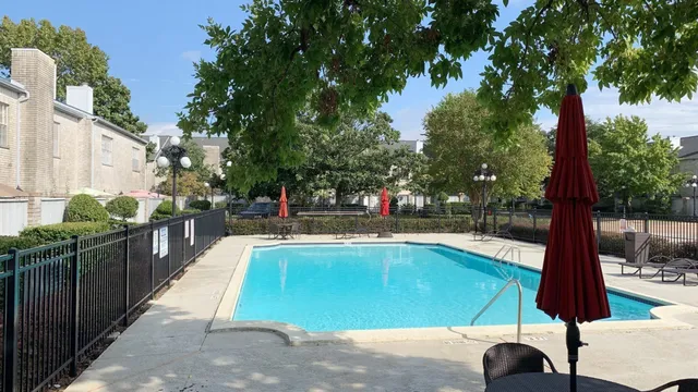 a view of swimming pool with chairs