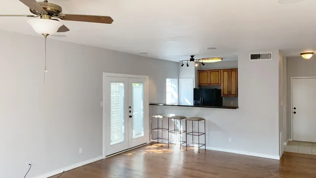 a view of a livingroom with furniture and wooden floor