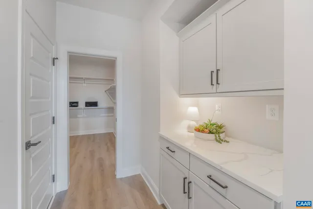 a bathroom with a sink and vanity