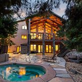 a view of swimming pool with outdoor seating and a patio
