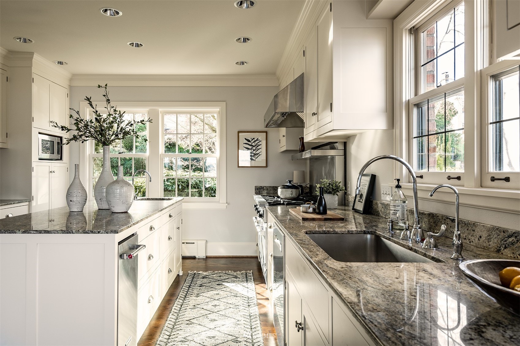 3328 Cascadia Avenue South Seattle, WA 98144 - Photo 15 of 40 a kitchen with granite countertop a sink and a stove top oven