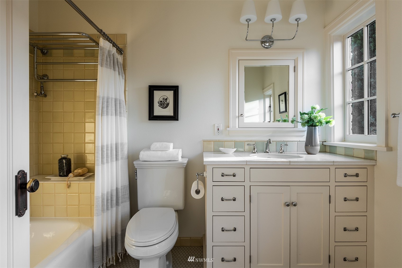 3328 Cascadia Avenue South Seattle, WA 98144 - Photo 24 of 40 a bathroom with a granite countertop toilet sink and a shower