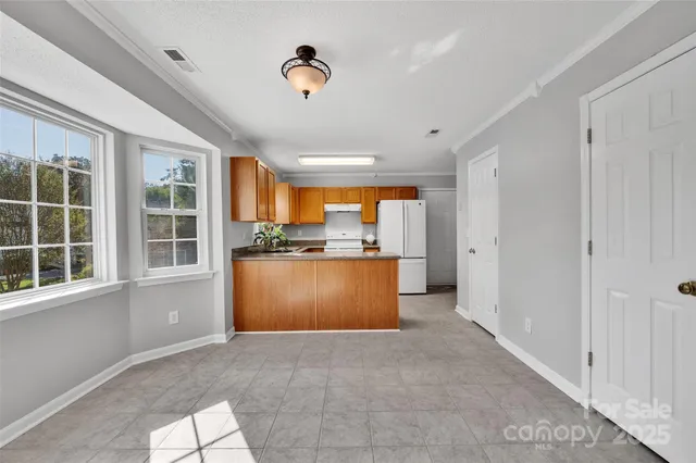 a view of kitchen and front door