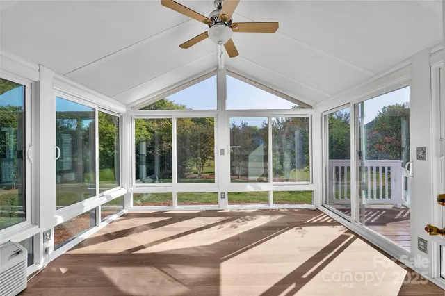 a bedroom with a large window and a large window