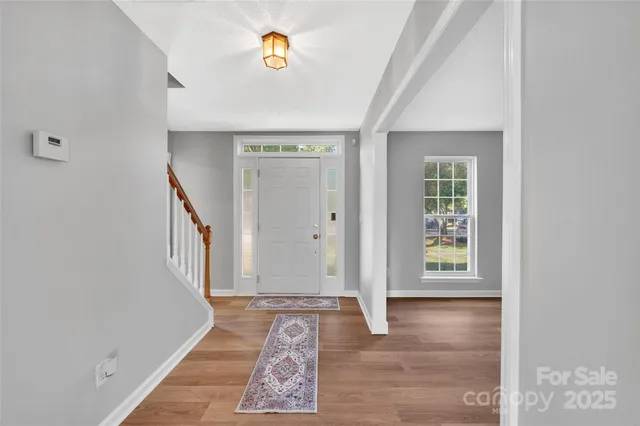 an entryway with a rug