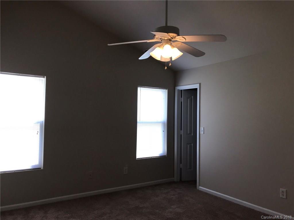 838 Rook Road Charlotte, NC 28216 - Photo 11 of 13 a view of a chandelier fan and entryway