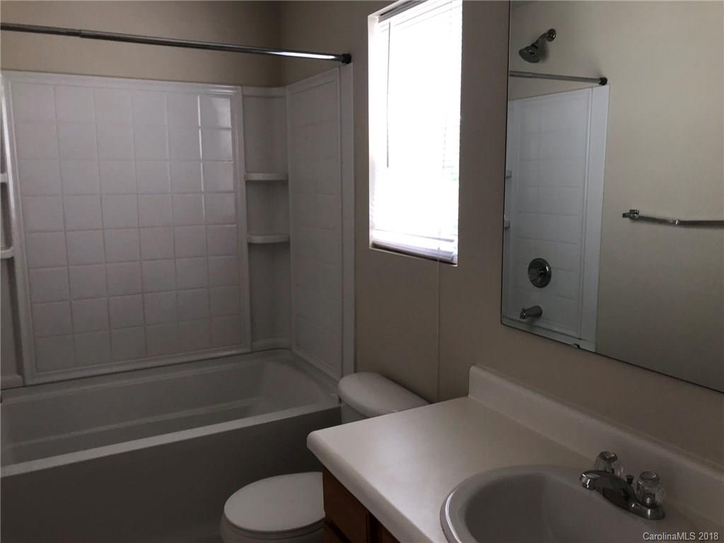 838 Rook Road Charlotte, NC 28216 - Photo 5 of 13 a bathroom with a sink and a tub