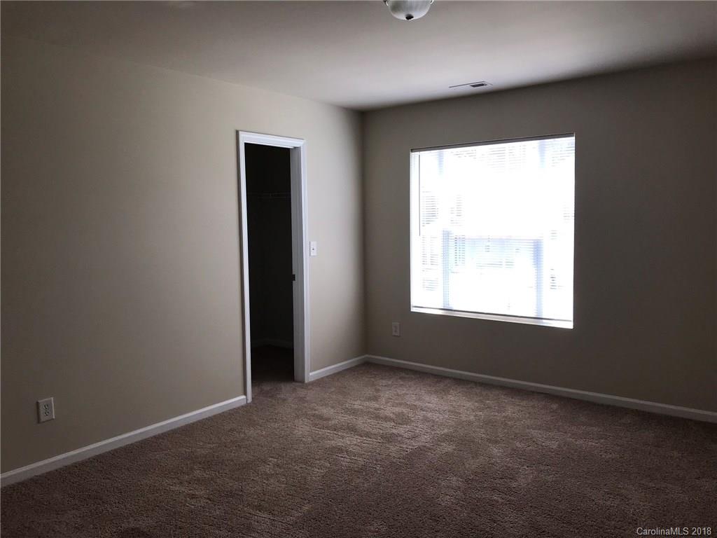 838 Rook Road Charlotte, NC 28216 - Photo 6 of 13 an empty room with a window