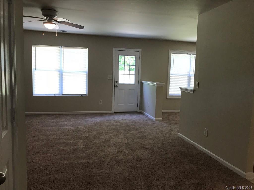 838 Rook Road Charlotte, NC 28216 - Photo 7 of 13 a view of an empty room with a window
