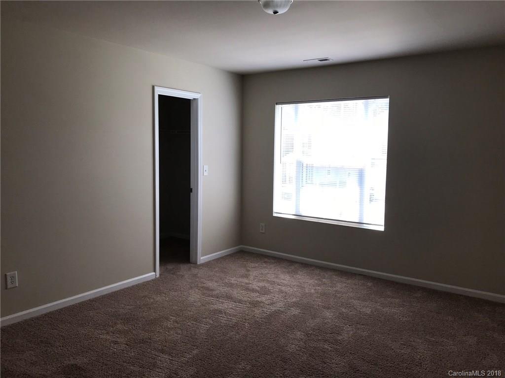 838 Rook Road Charlotte, NC 28216 - Photo 8 of 13 an empty room with a window