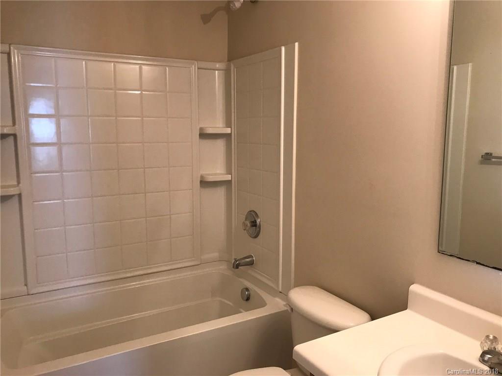 838 Rook Road Charlotte, NC 28216 - Photo 9 of 13 a bathroom with a toilet and shower