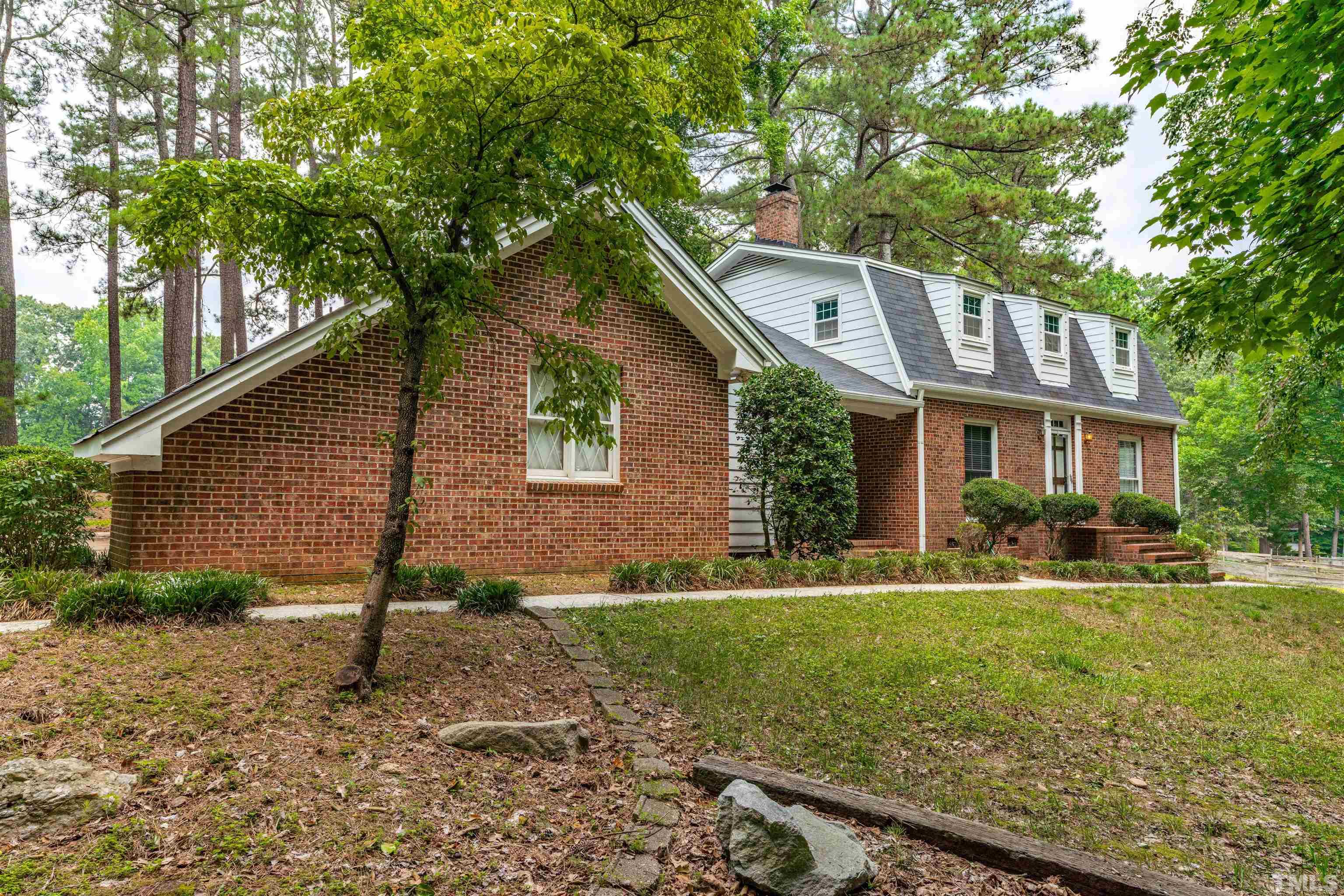 8424 Crowder Road Raleigh, NC 27603 - Photo 2 of 70 a front view of a house with a yard