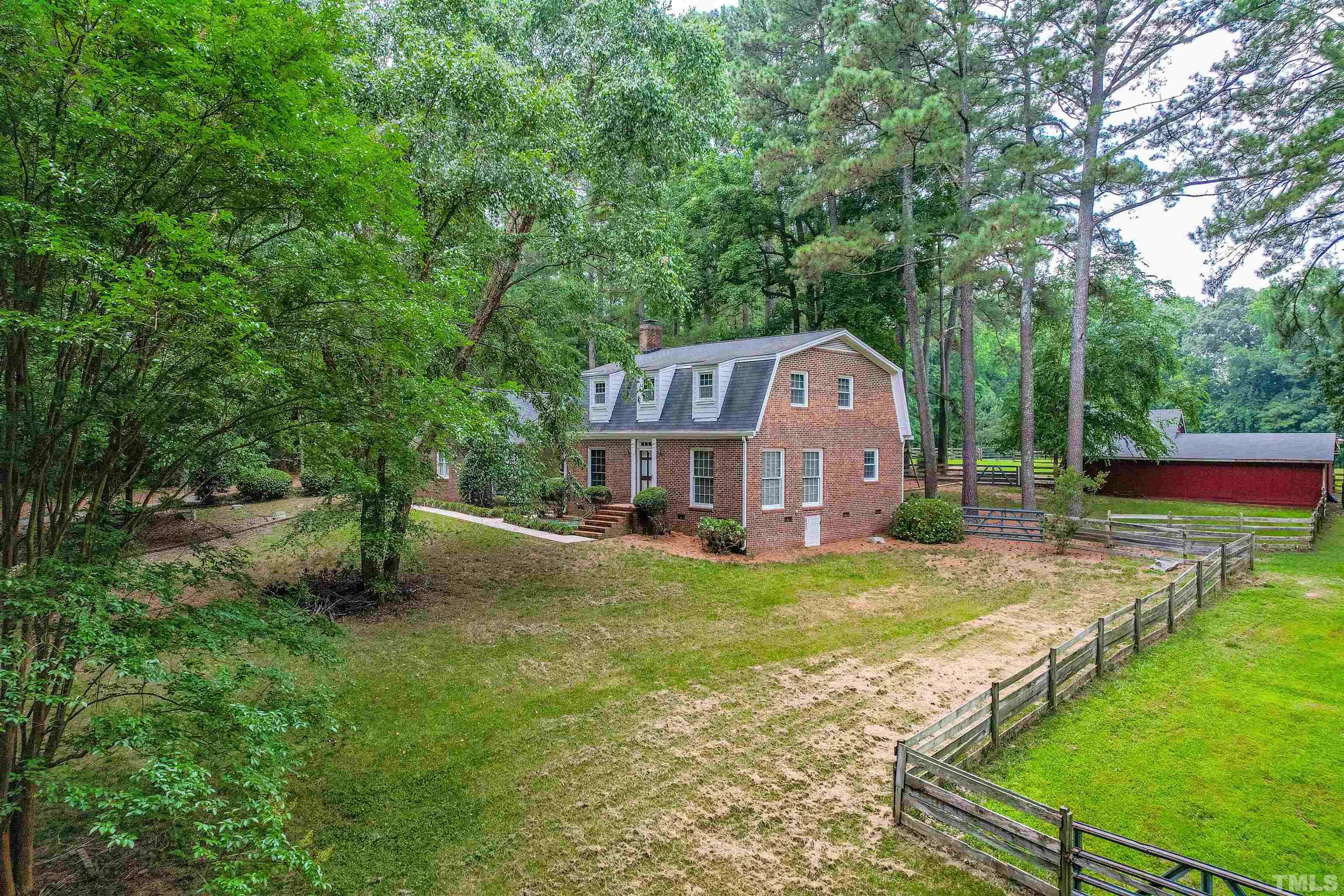 8424 Crowder Road Raleigh, NC 27603 - Photo 4 of 70 a front view of a house with yard patio and green space