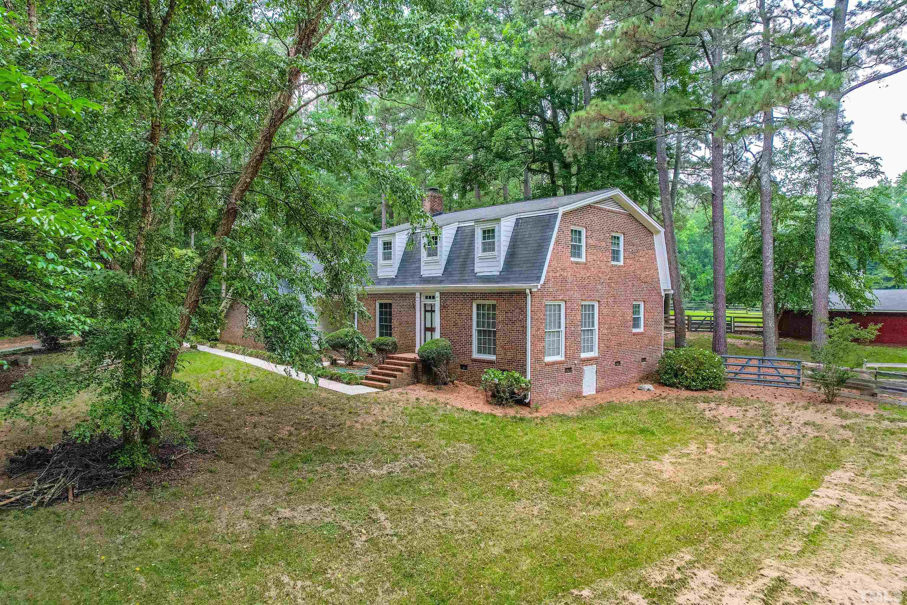 8424 Crowder Road Raleigh, NC 27603 - Photo 5 of 70 a front view of a house with garden