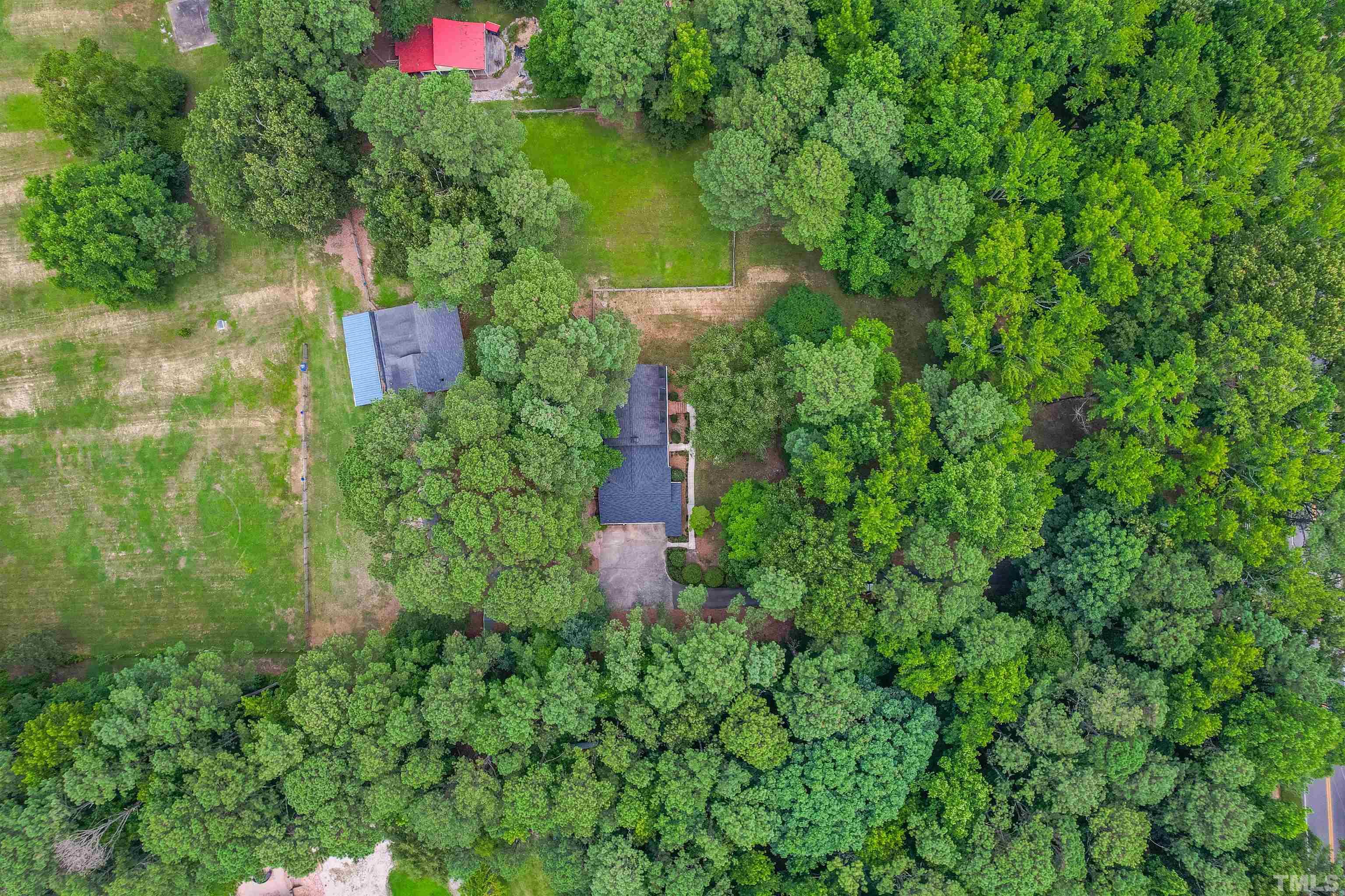 8424 Crowder Road Raleigh, NC 27603 - Photo 59 of 70 a view of a house with a yard and plants