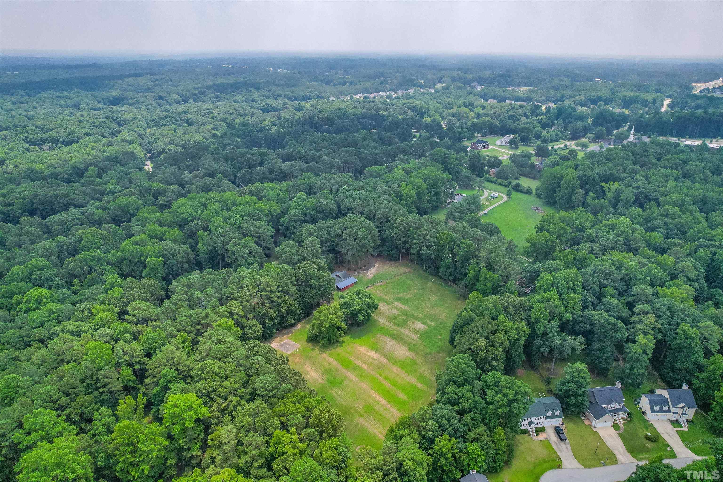 8424 Crowder Road Raleigh, NC 27603 - Photo 70 of 70 a view of a green yard with an trees