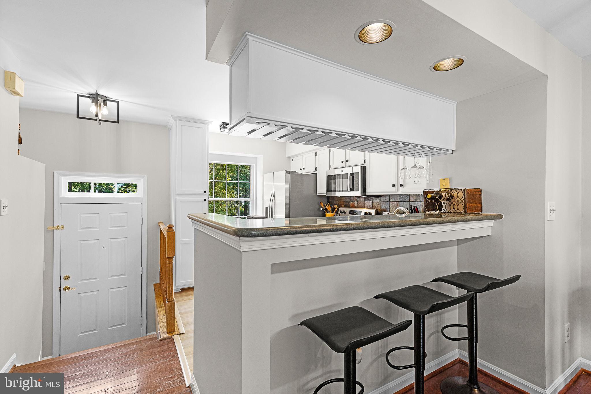 6582 Skylemar Trail Centreville, VA 20121 - Photo 14 of 46 a kitchen with a sink cabinets and window