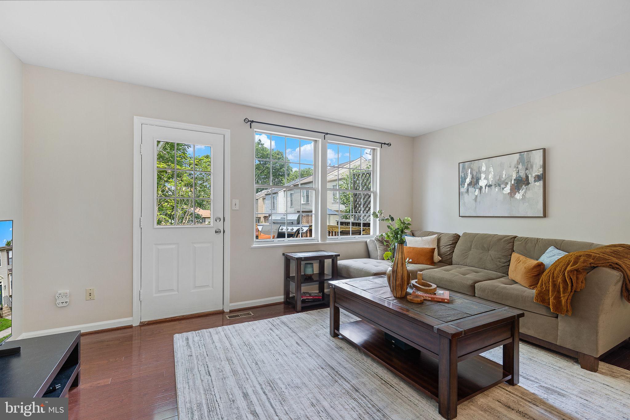 6582 Skylemar Trail Centreville, VA 20121 - Photo 22 of 46 a living room with furniture and a large window