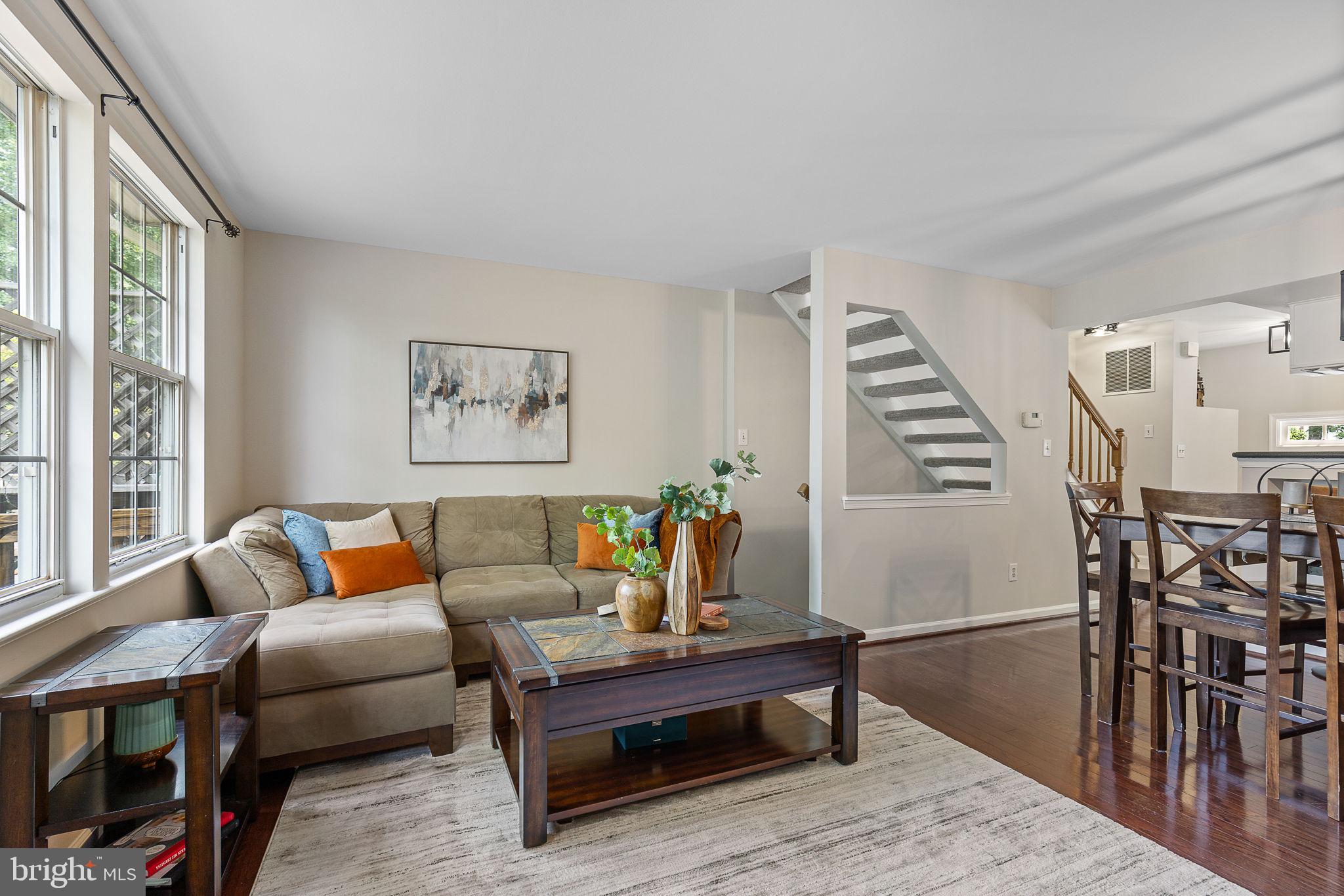 6582 Skylemar Trail Centreville, VA 20121 - Photo 23 of 46 a living room with furniture and a wooden floor