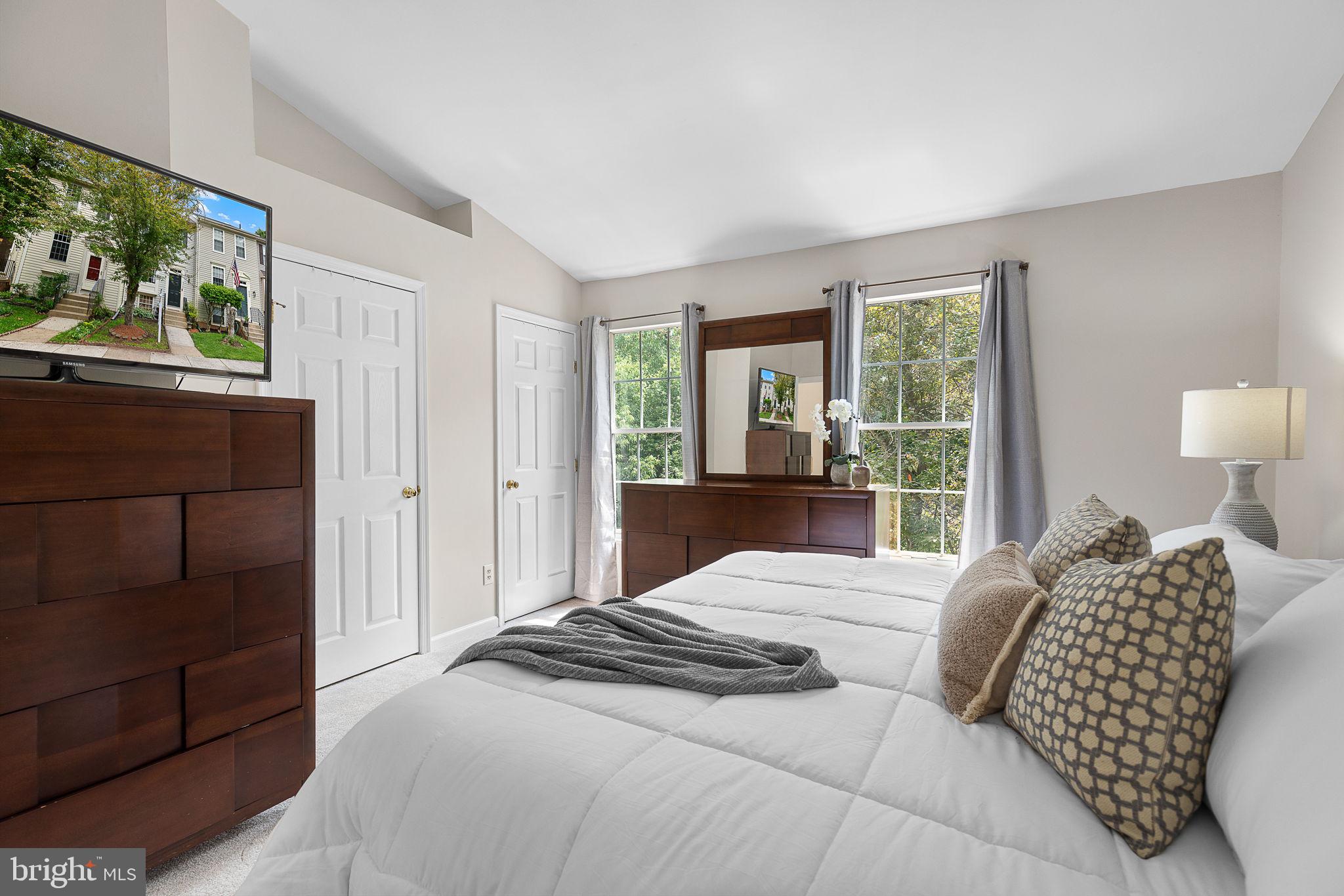 6582 Skylemar Trail Centreville, VA 20121 - Photo 27 of 46 a bedroom with a bed mirror and window