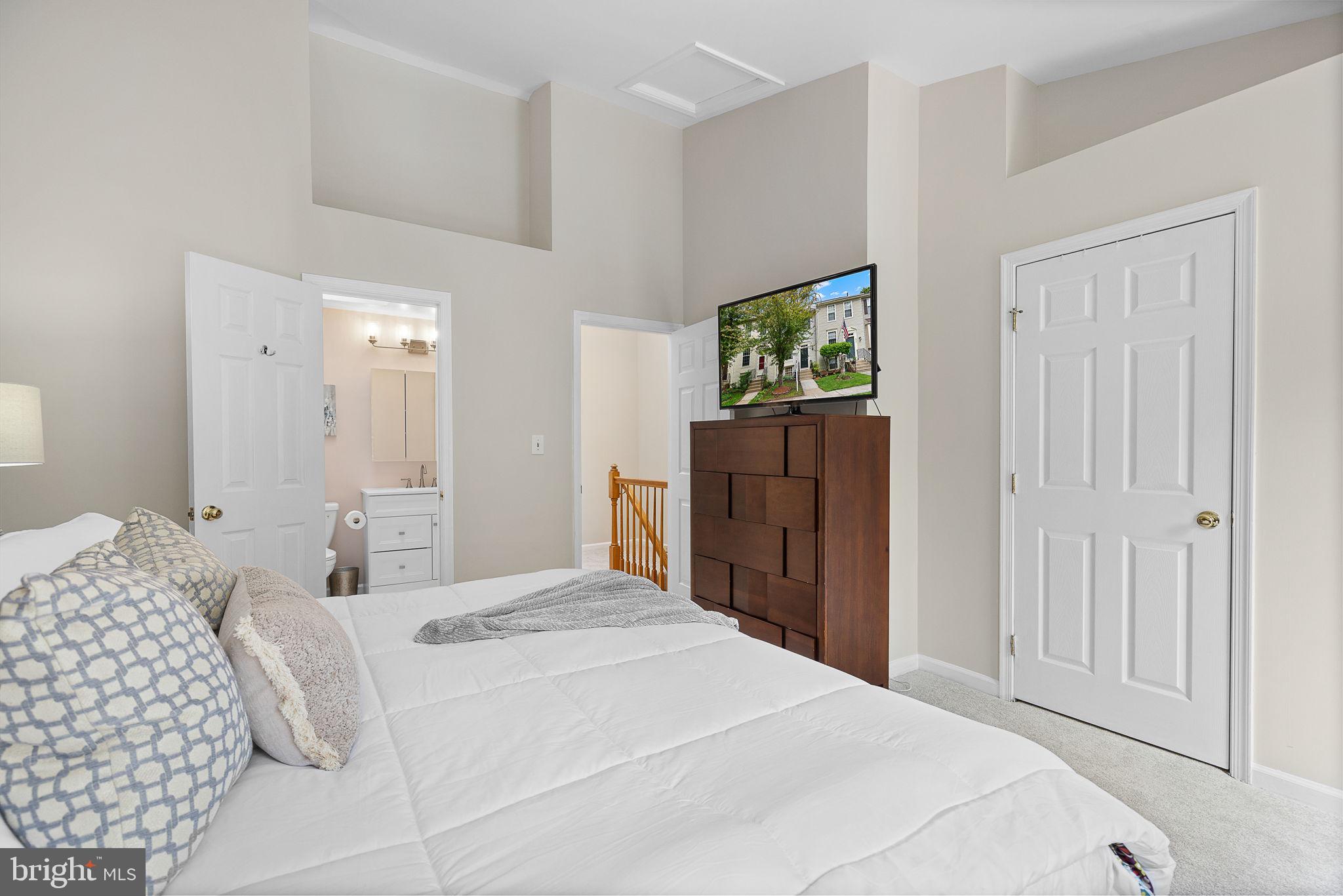 6582 Skylemar Trail Centreville, VA 20121 - Photo 29 of 46 a bedroom with a bed and a painting on the wall