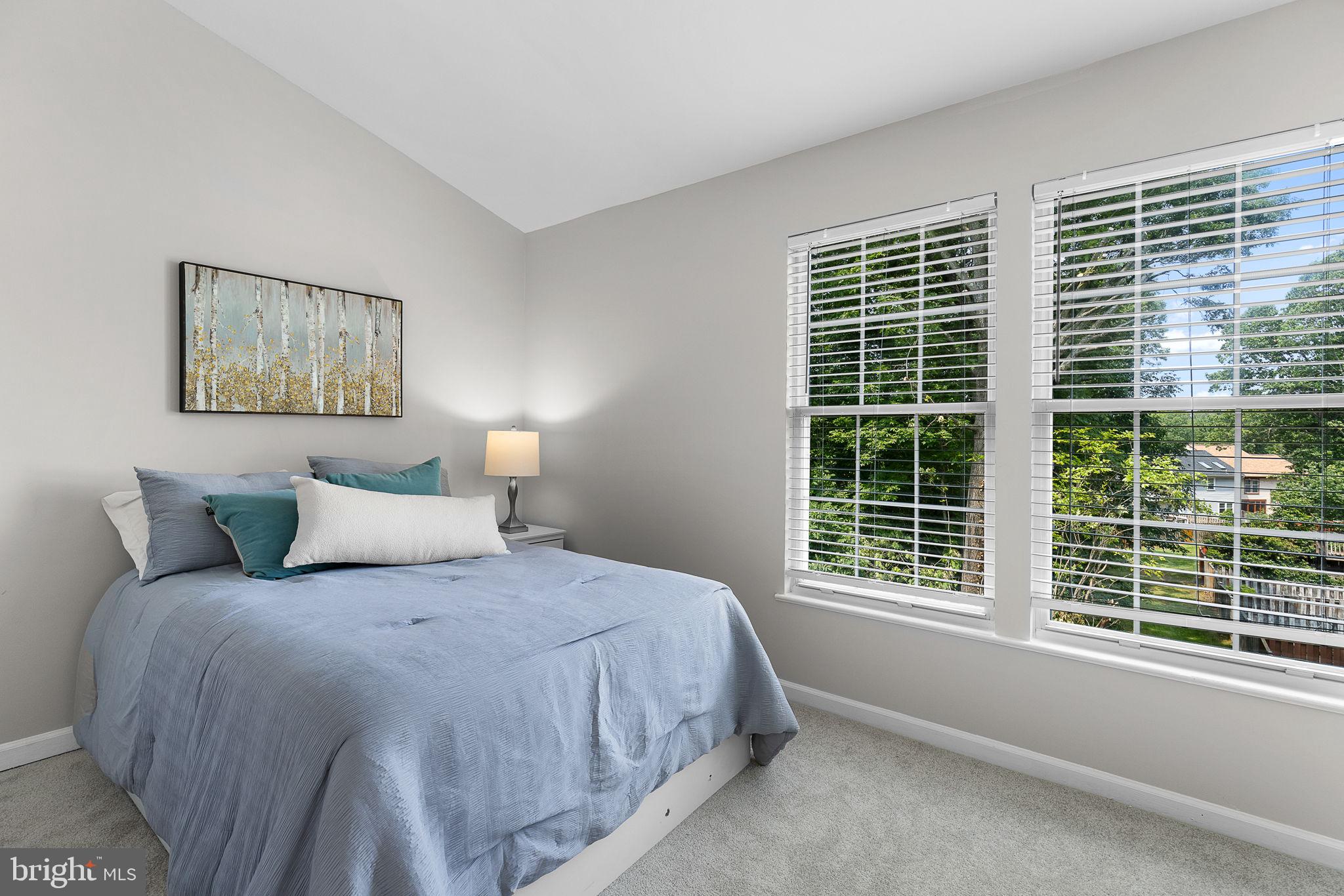 6582 Skylemar Trail Centreville, VA 20121 - Photo 30 of 46 a bedroom with a large bed and a window