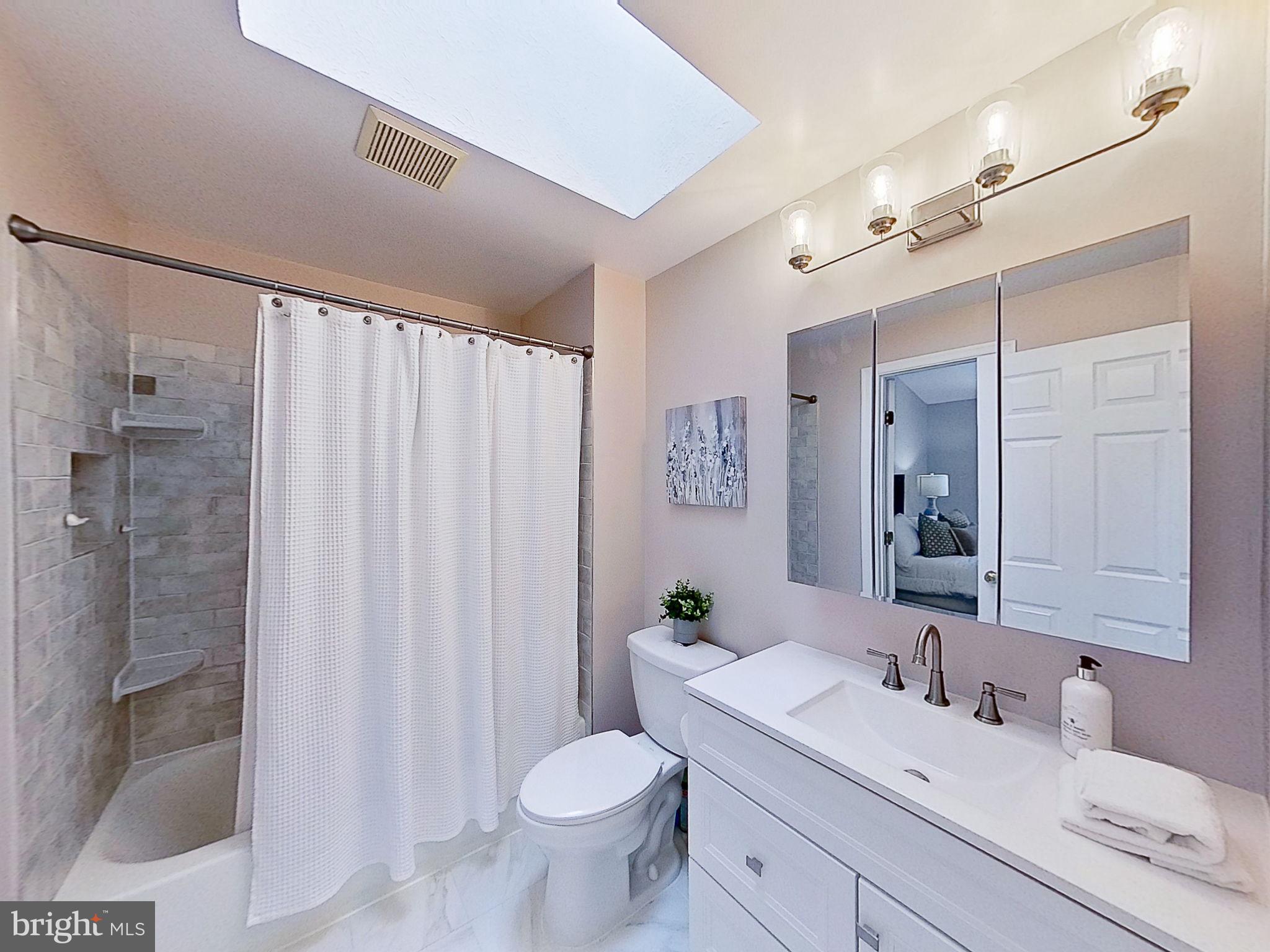 6582 Skylemar Trail Centreville, VA 20121 - Photo 34 of 46 a bathroom with a sink toilet and shower