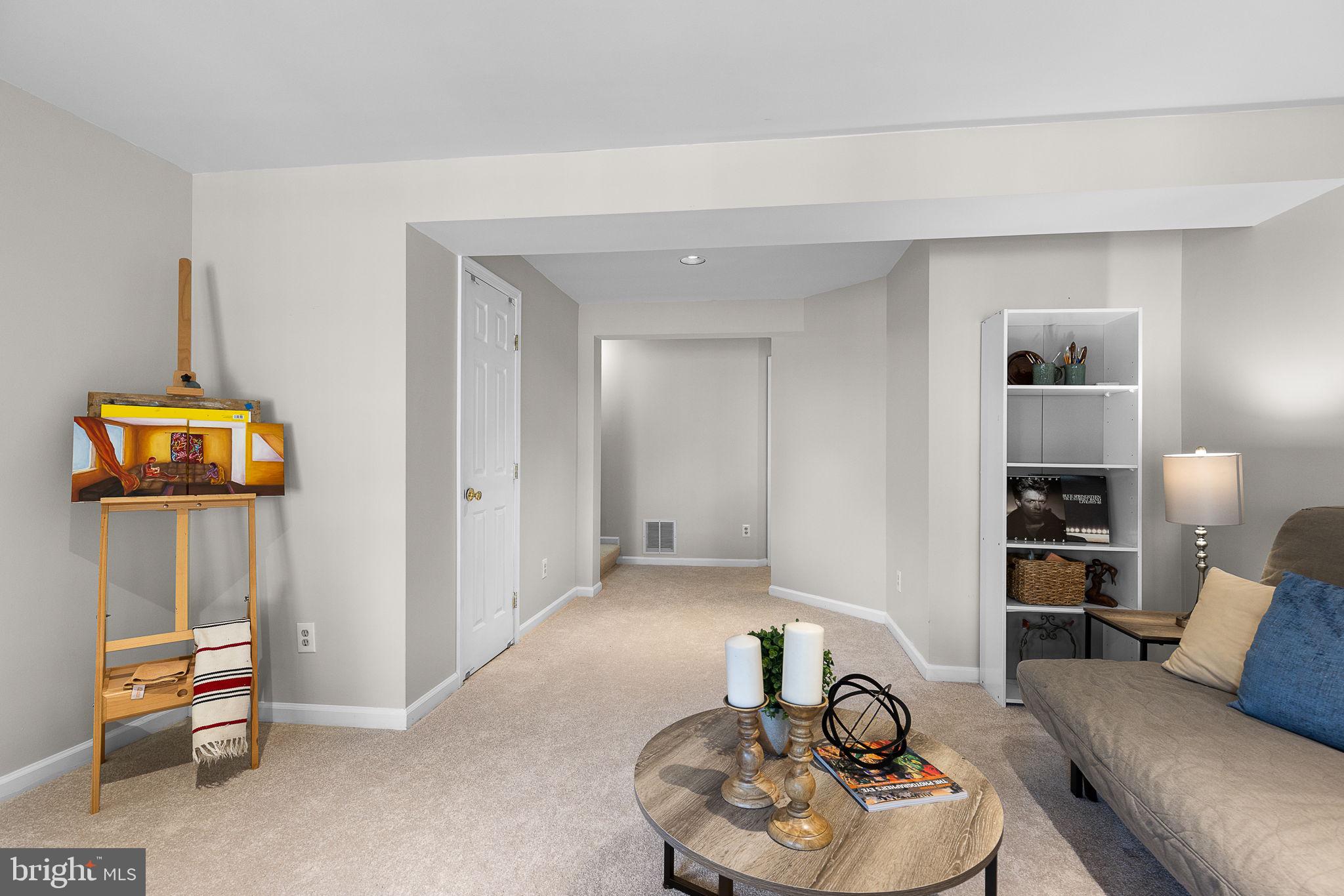 6582 Skylemar Trail Centreville, VA 20121 - Photo 39 of 46 a living room with furniture and a wooden floor