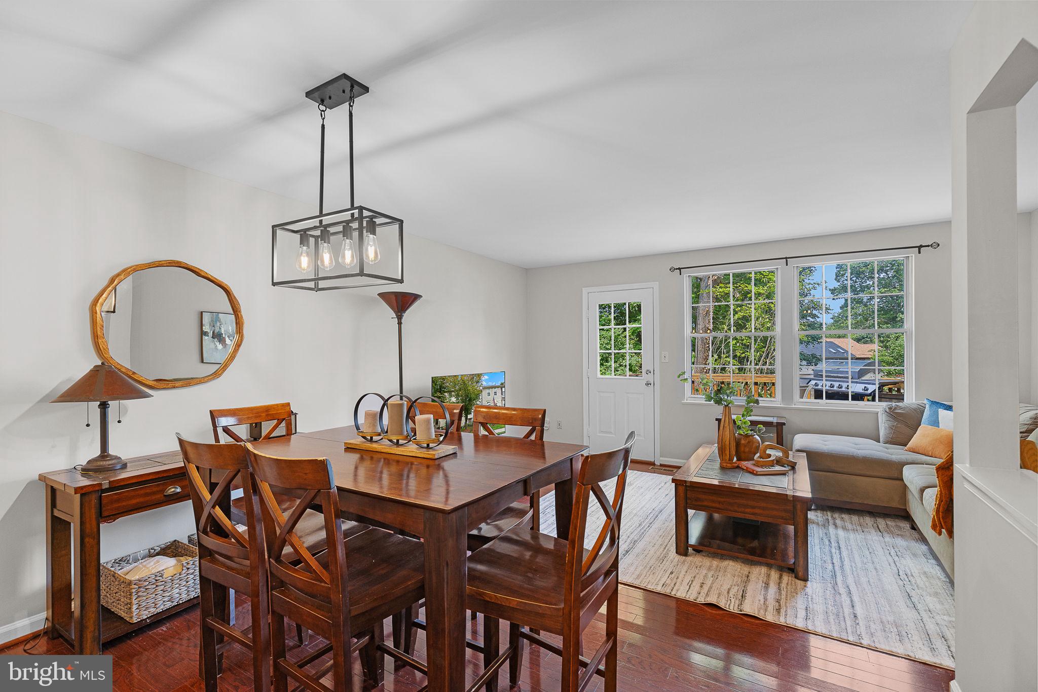 6582 Skylemar Trail Centreville, VA 20121 - Photo 4 of 46 a view of a dining room with furniture window and wooden floor