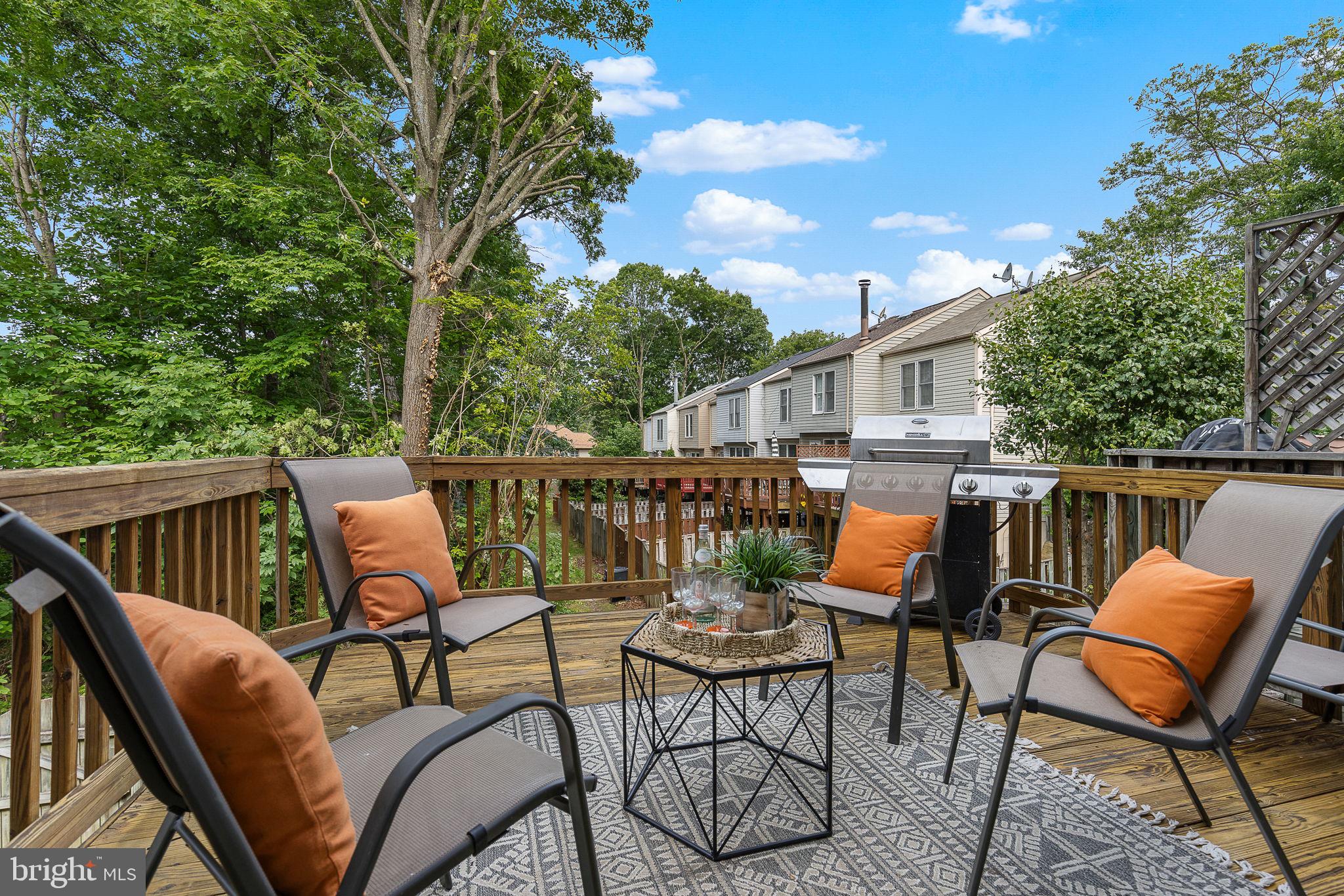 6582 Skylemar Trail Centreville, VA 20121 - Photo 41 of 46 a balcony with wooden floor and outdoor seating
