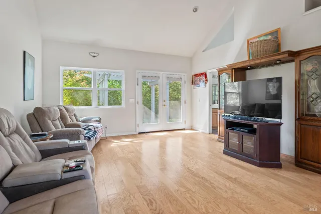 a large bedroom with a bed and a large window
