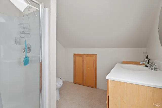 a view of a porch with furniture and a yard