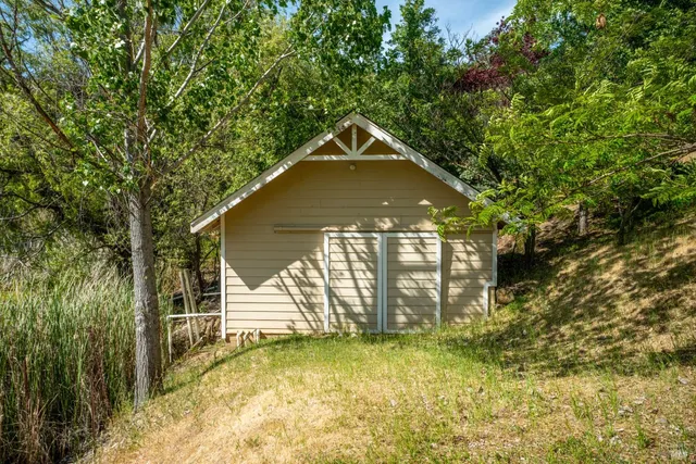 a front view of house with yard and green space