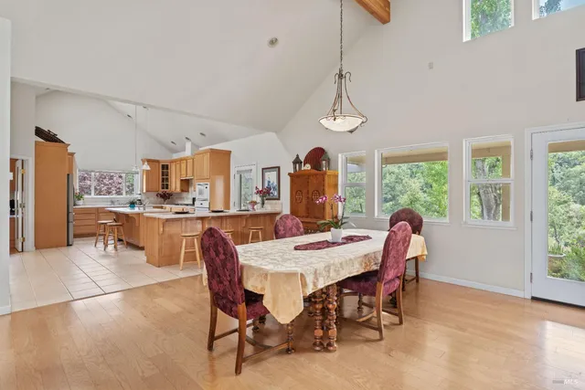 a view of a dining room with furniture window and outside view