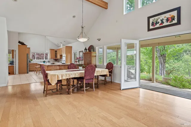 a view of a dining room with furniture window and outside view