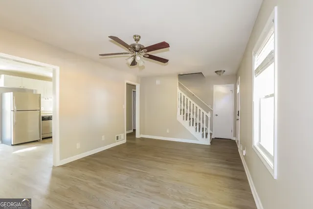 a view of an entryway with wooden floor