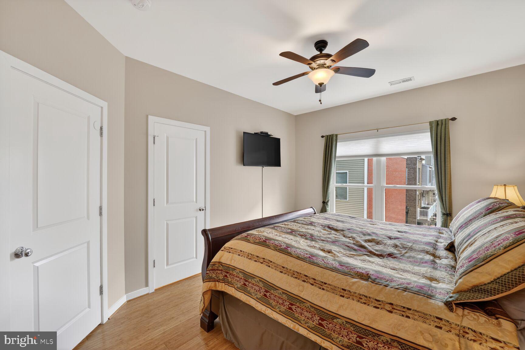 814 3rd Street Southeast Washington, DC 20003 - Photo 15 of 36 a bedroom with a large bed and a window