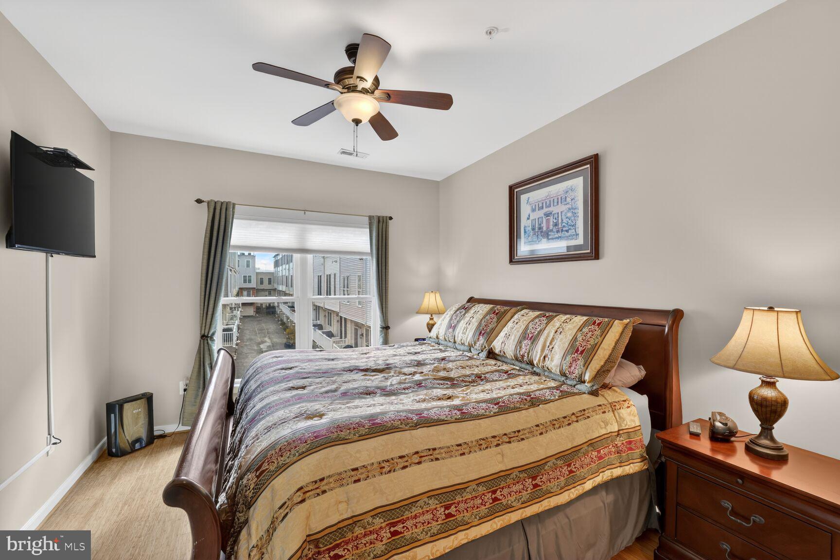 814 3rd Street Southeast Washington, DC 20003 - Photo 16 of 36 a bedroom with a bed and a chandelier