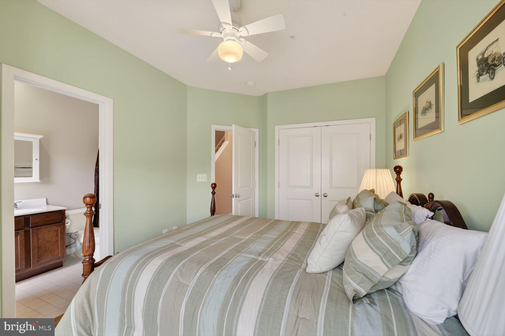 814 3rd Street Southeast Washington, DC 20003 - Photo 20 of 36 a bedroom with a bed and a chandelier