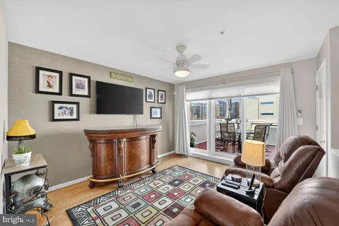 a living room with a couch and a chandelier
