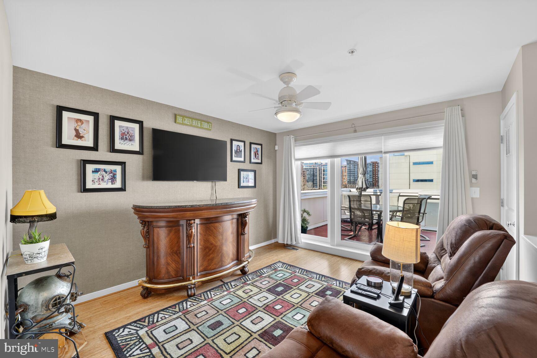 814 3rd Street Southeast Washington, DC 20003 - Photo 23 of 36 a living room with a couch and a chandelier